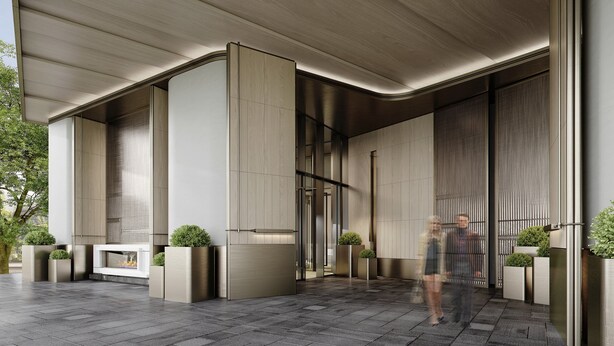 A modern building entrance with a curved roof, large glass doors, and potted plants. - Holiday Inn Changchun High Tech Zone by IHG (Changchun)