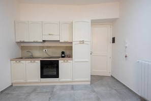 Superior Apartment, Balcony, Courtyard View | Private kitchen | Espresso maker, coffee/tea maker, electric kettle, highchair