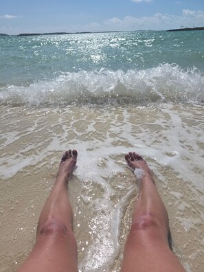 On the beach, sun loungers, beach towels