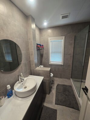 Shower, hair dryer, towels, soap