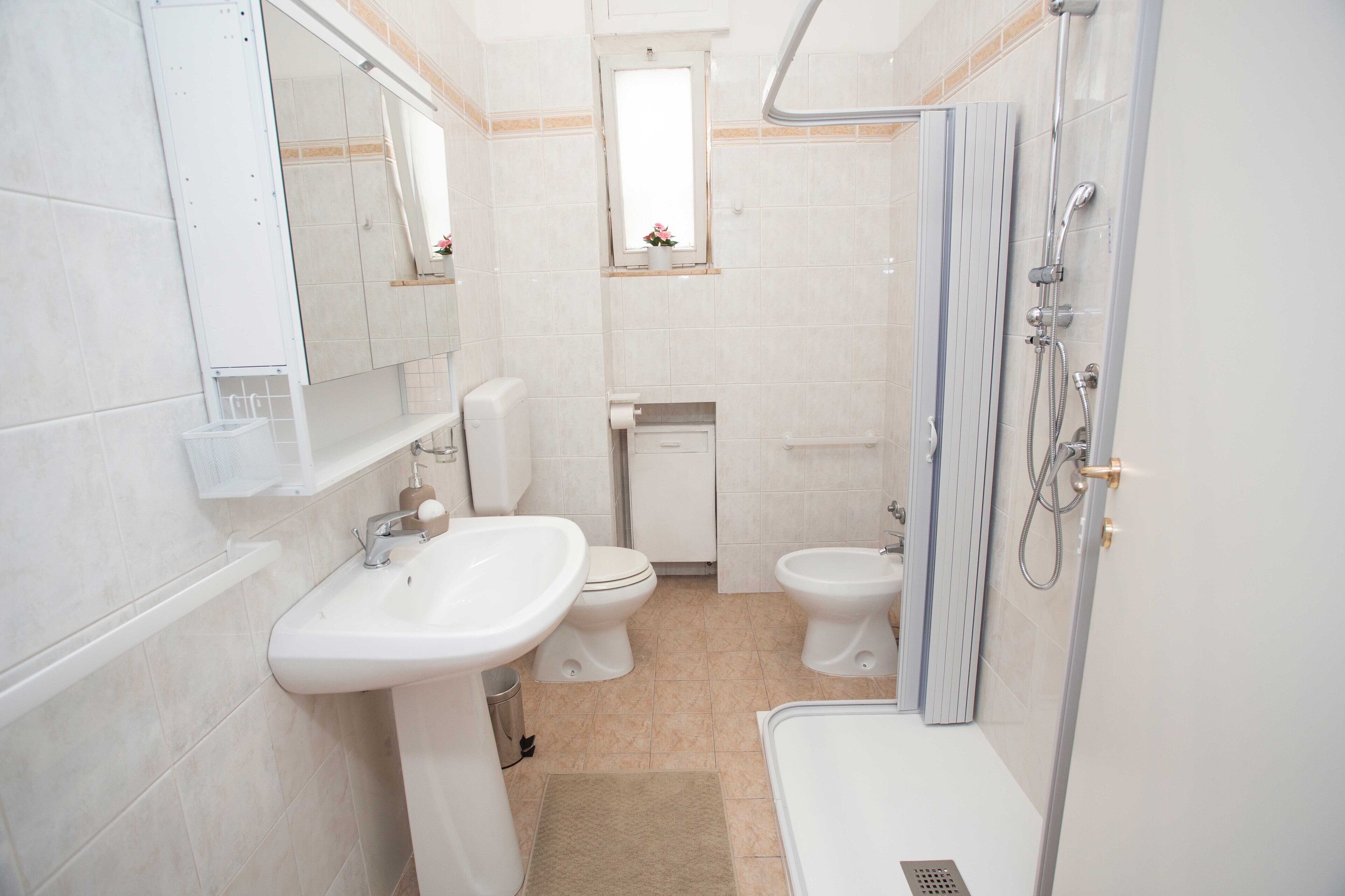 Shower, deep-soaking bathtub, towels