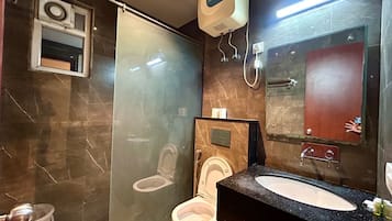 Shower, designer toiletries, hair dryer, slippers