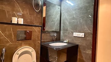 Shower, designer toiletries, hair dryer (on request), slippers