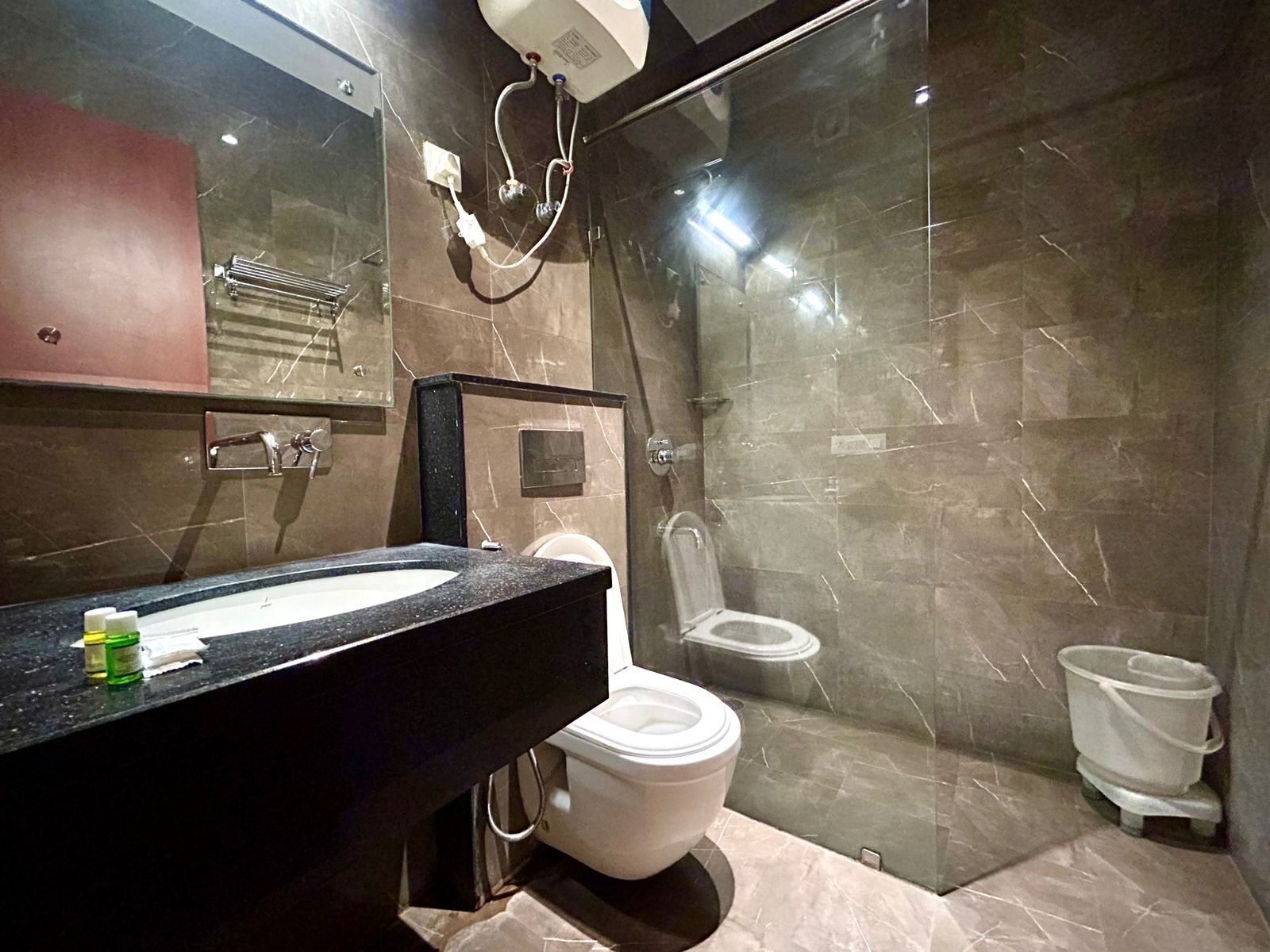 Deluxe Double Room, City View | Bathroom | Shower, designer toiletries, hair dryer, slippers