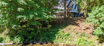 Peaceful Forest Riverfront Escape near PDX w/ Hot Tub, Kayaks, & River Access