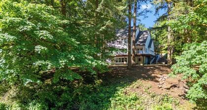 Peaceful Forest Riverfront Escape near PDX w/ Hot Tub, Kayaks, & River Access