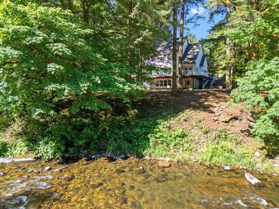Peaceful Forest Riverfront Escape near PDX w/ Hot Tub, Kayaks, & River Access