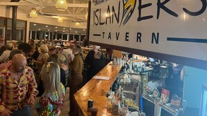 A crowded indoor space with a bar area labeled "Islanders Tavern." - Hindmarsh Hideaway-—Waterfront Pet-friendly Living (Hindmarsh Island)