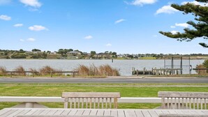 A lakeside view with a dock, grassy area, and benches. - Percy`s Place: Family-friendly Waterfront Serenity (Goolwa)