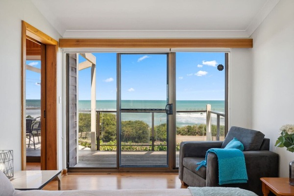Enjoy uninterrupted sea views from the comfort of the bedroom seating area.