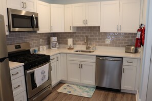 Fridge, microwave, oven, stovetop - Beachside Bliss: Cozy 2-Bed Retreat, Steps from the Shore, with WiFi, AC & More! (Wildwood Crest)