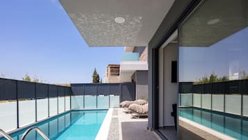 Outdoor pool, pool umbrellas, pool loungers