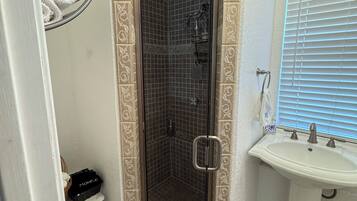 Shower, hair dryer, towels, soap