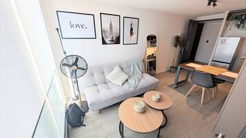 Apartamento superior, 1 quarto | Área de estar