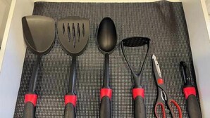 A kitchen utensil set on a black mat. - Superb Chambray 4 Beds, 2 Baths in Moreno Valley, CA. (Moreno Valley)