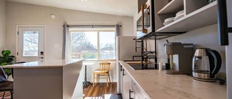 Fridge, microwave, stovetop, coffee/tea maker