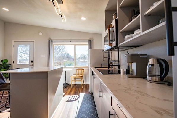 Fridge, microwave, stovetop, coffee/tea maker