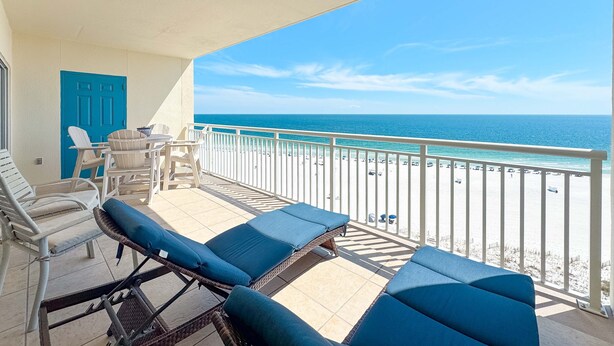 A balcony with lounge chairs and a view of the beach. - Admiral Quarters 804 | Beachfront | Indoor & Outdoor Pools | Beach Getaways (Orange Beach)