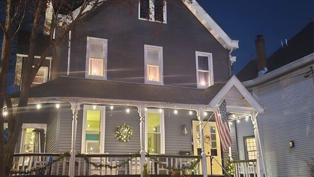 A two-story house with a porch, a small front yard, and a garage. - 3-bedroom house in charming College Hill, Easton, PA with WiFi, AC. Book now (Easton)