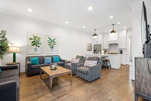 A modern living room with a sofa, armchairs, and a coffee table. - 19 Bed Downtown Rooftop Gameroom Walk To Broadway (Nashville)