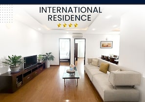 Family Apartment, 2 Bedrooms, Balcony, City View | Living area | Fireplace, printers