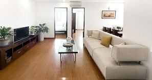 Family Apartment, 2 Bedrooms, Balcony, City View | Living area | Fireplace, printers