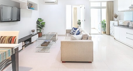 Apartment, 1 Bedroom, Balcony, City View | In-room safe, desk, laptop workspace, iron/ironing board