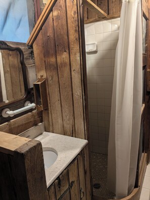 Shower, hair dryer, towels, toilet paper
