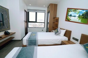 Habitación Deluxe con 1 cama doble o 2 individuales, vistas a la ciudad | Cortinas opacas y sistema de insonorización