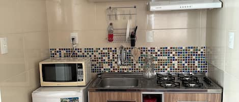 Fridge, microwave, stovetop, coffee/tea maker