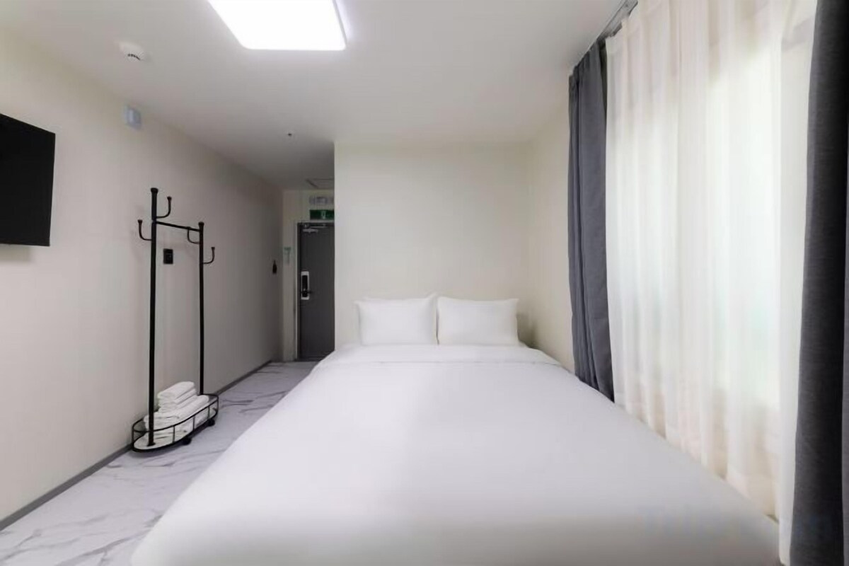Down comforters, blackout drapes, WiFi (free), bed sheets