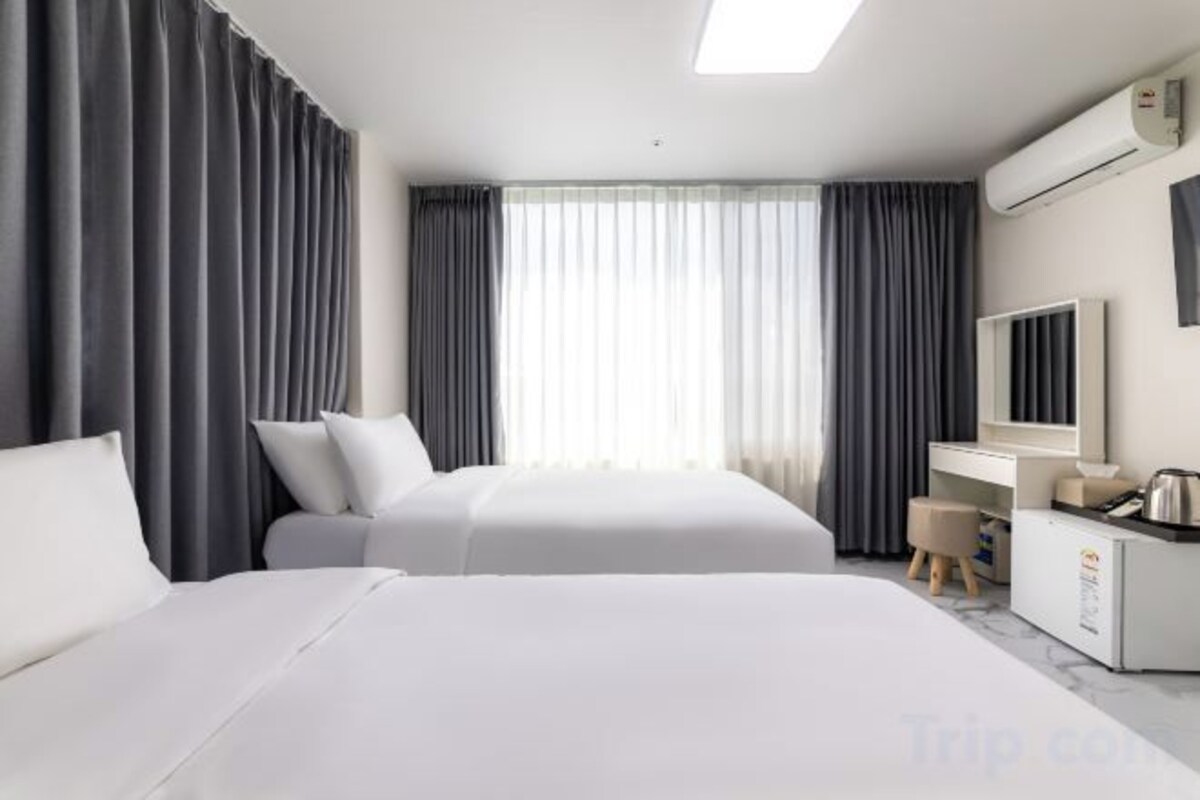 Down comforters, blackout drapes, WiFi (free), bed sheets