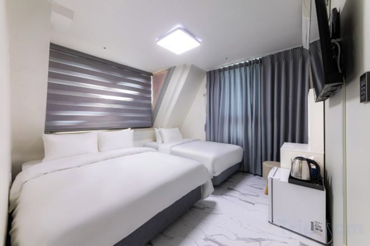 Down comforters, blackout drapes, WiFi (free), bed sheets