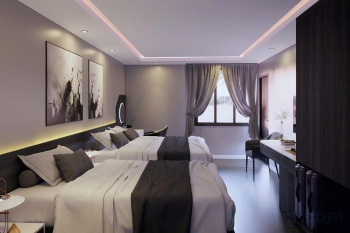 Premium bedding, memory foam beds, desk, laptop workspace