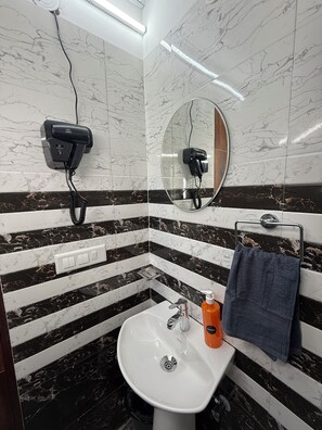Hair dryer, towels, soap, toilet paper