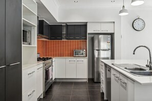 Microwave, cookware/dishes/utensils, dining tables