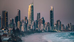 A city skyline with high-rise buildings, a beach, and the ocean. - Chic 1BR Getaway Steps from Beach&Surfers Paradise (Surfers Paradise)