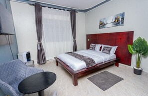 Standard Apartment, Balcony | Living area - The Den Soroti White (Soroti)