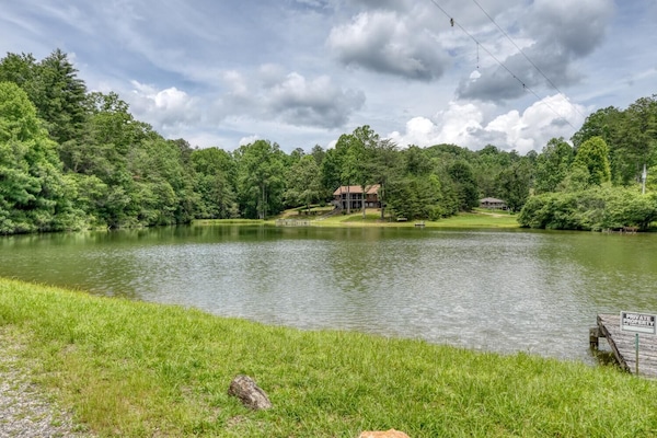 Peaceful retreat by the water, surrounded by nature.