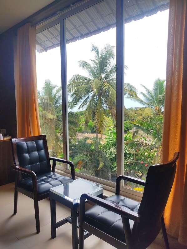 Suite Deluxe, vue jardin | Restauration dans la chambre