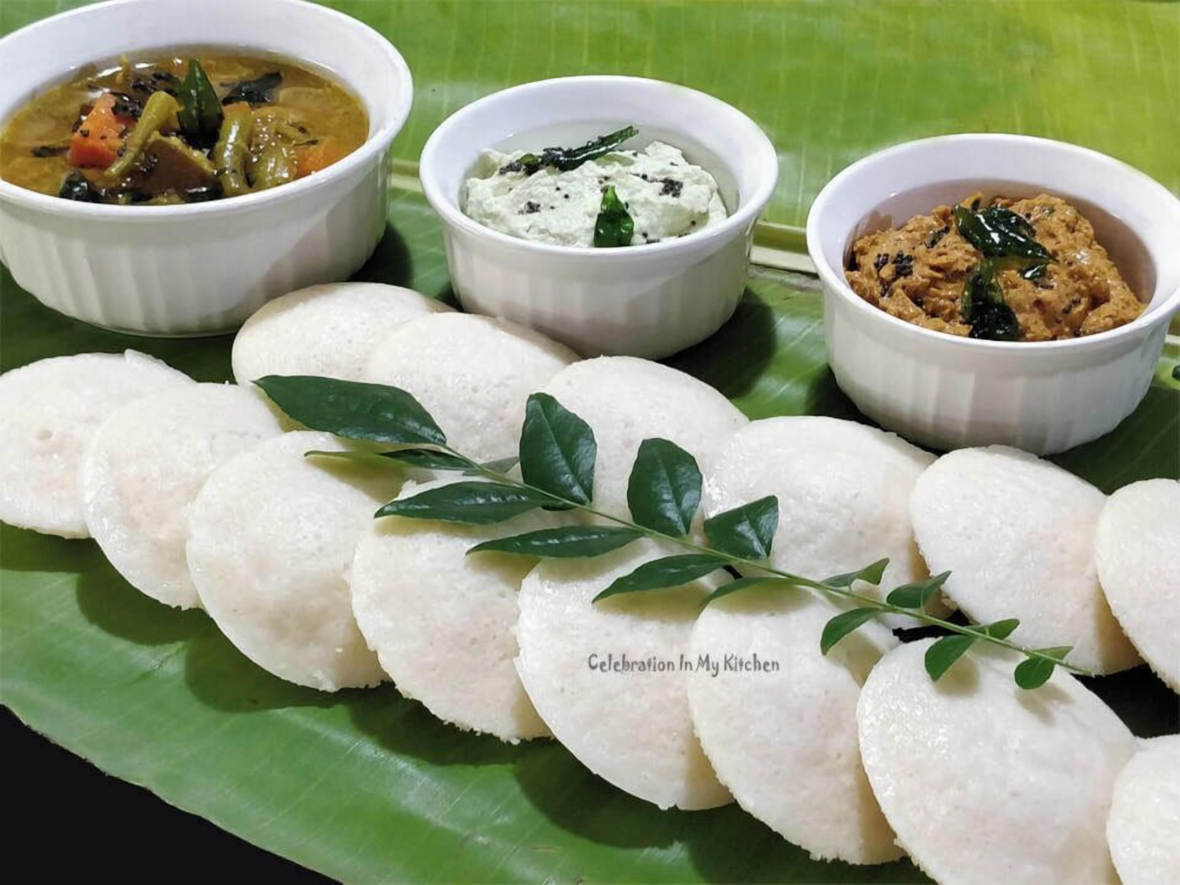 A traditional South Indian meal with idlis, coconut chutney, and sambar.