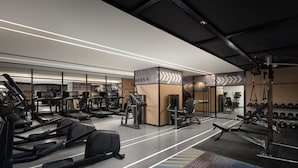 A modern gym with treadmills, weight machines, and free weights. - Beijing Chengying Hotel - Sanlitun Taikoo Li (Beijing)