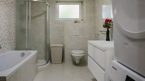 Shower, hair dryer, towels