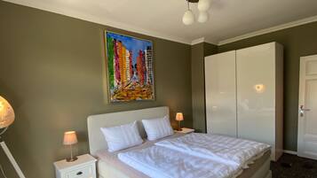 2 dormitorios, tabla de planchar con plancha, wifi gratis y ropa de cama