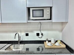 Comfort Apartment, 1 Bedroom | Private kitchen | Fridge, microwave, coffee/tea maker, electric kettle