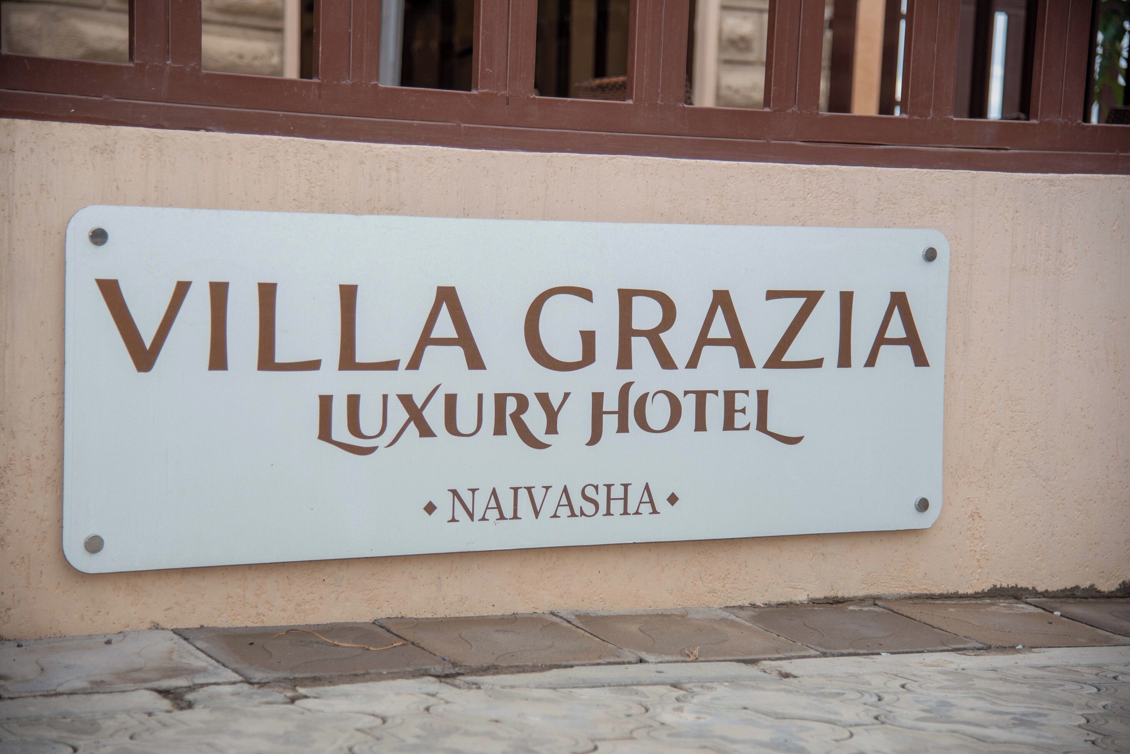 A sign for Villa Grazia Luxury Hotel in Naivasha.