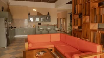 Comfort Penthouse, Balcony, Ocean View | Living area | 22-inch LCD TV with cable channels