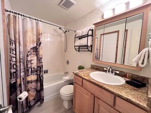 Shower, hair dryer, towels, shampoo