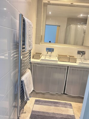 Shower, hair dryer, towels, soap