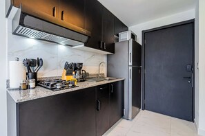 Fridge, microwave, stovetop, coffee/tea maker